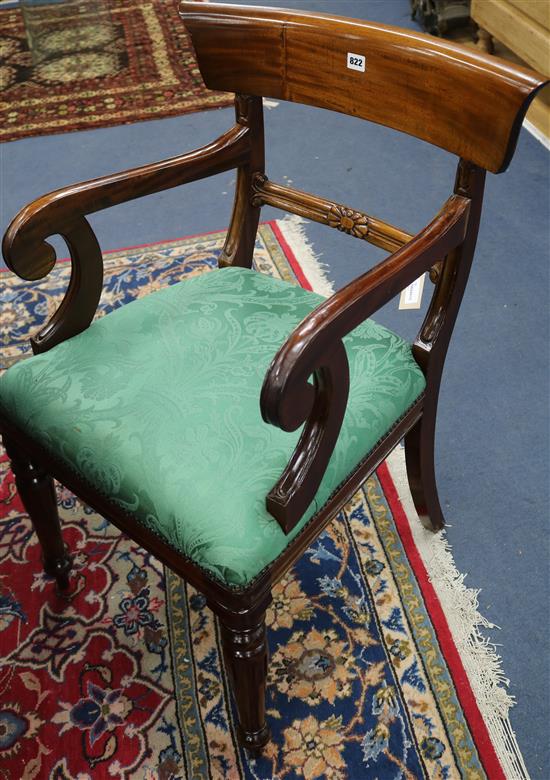 A set of ten late Georgian style mahogany dining chairs (two having arms)